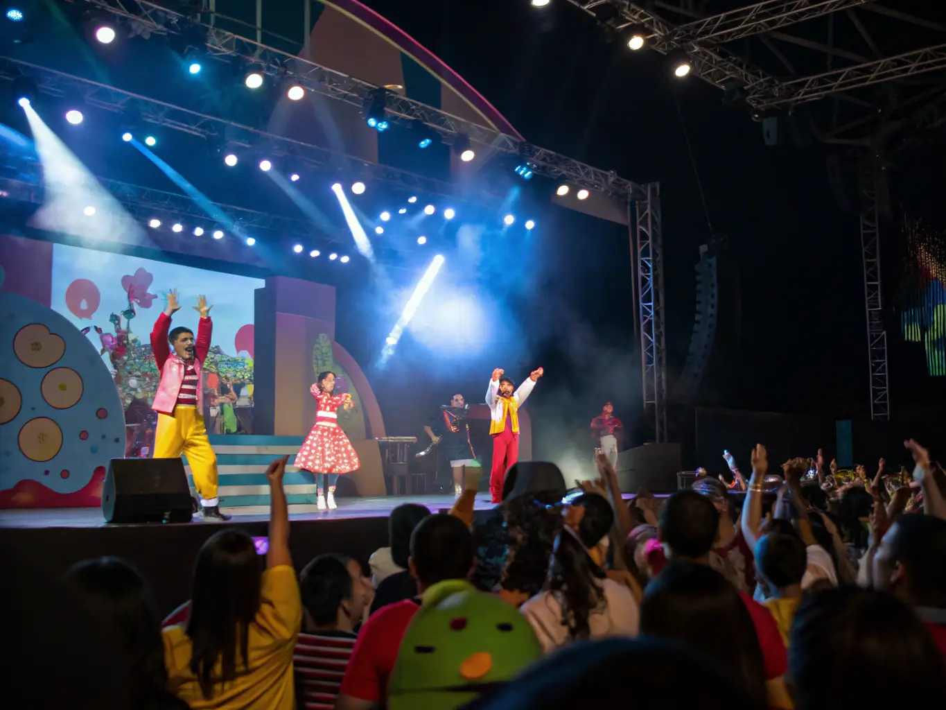 A photograph capturing a community performance event, with diverse participants and audience members enjoying the show, highlighting the inclusive nature of ABQDV's activities.